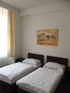 Säng eller sängar i ett rum på Promohotel Slavie