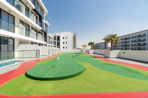 a miniature golf course on the side of a building at TAMM HOMES-SAMANA GOLF AVENUE in Dubai