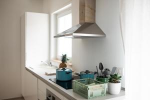 a kitchen with pots and pans on a counter at Silvia’s Home in Monopoli +45 photos