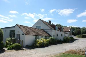 a white house with a driveway at Farmers Arms in Taunton