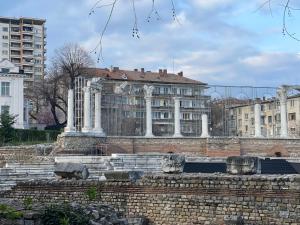 a building in a city with buildings in the background at Apartment Antique Theatre 3 - RETRO in Stara Zagora
