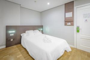 Posteľ alebo postele v izbe v ubytovaní Hotel Mogay