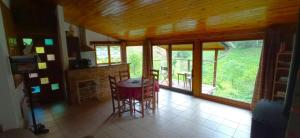 a room with a table and chairs in a house at Gite à la Ferme in Arrodets-ez-Angles