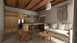 Pnoes Skyros في سكيروس: غرفة معيشة مع أريكة ومطبخ