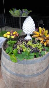 a bunch of fruit on top of a barrel at Baglio Eldama in Castelvetrano Selinunte