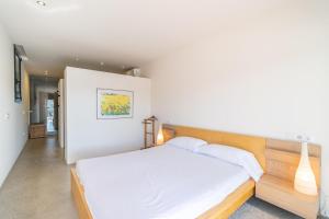 Postel nebo postele na pokoji v ubytování Villa Noelia