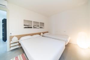 Postel nebo postele na pokoji v ubytování Villa Noelia