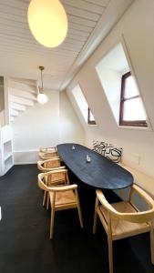 a room with a large table and chairs at Le FauBourg Suites in Antwerp