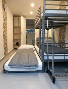a bedroom with two bunk beds in a room at Flower 3 free parking in Siófok