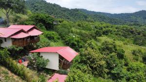 an overhead view of two houses with red roofs at Bungalows Ayampe in Ayampe