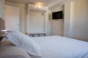 Posteľ alebo postele v izbe v ubytovaní Hotel Mogay