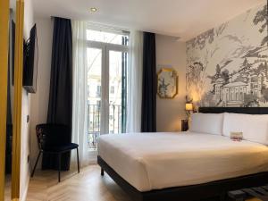 Postel nebo postele na pokoji v ubytování Oriente Atiram Hotel
