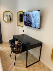 TV a/nebo společenská místnost v ubytování Oriente Atiram Hotel