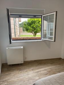 Zona d'estar a La Casita Alere en Playa Carnota con patio y barbacoa