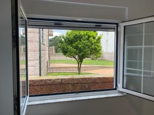 Jardí fora de La Casita Alere en Playa Carnota con patio y barbacoa