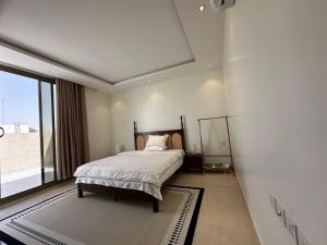 מיטה או מיטות בחדר ב-圆梦居