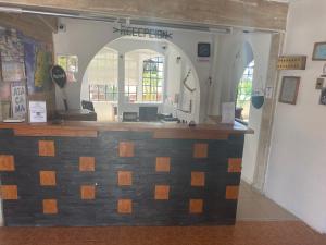 a store front with a stone counter in a building at Hotel Huasco in Huasco