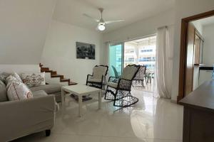 a living room with a couch and chairs and a table at La Fenice Beachfront 3 Bedroom With Parking in Las Terrenas