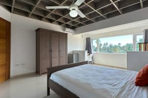 a bedroom with a bed and a ceiling fan at La Fenice Beachfront 3 Bedroom With Parking in Las Terrenas +16 photos