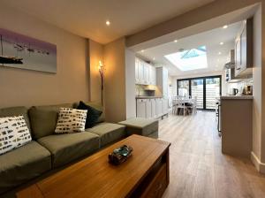 a living room with a couch and a kitchen at York Street in Cowes