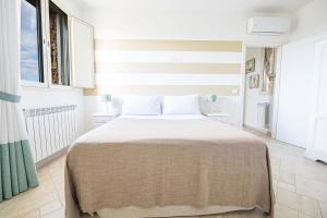 Postel nebo postele na pokoji v ubytování Villa Elisabetta con idromassaggio e area piscina