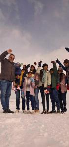 a group of people standing in the snow at Hotel Villa in Kutaisi