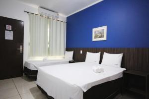 Postel nebo postele na pokoji v ubytování JS Thermas Hotel