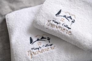 two towels with the words happy christmas on them at Marys Cottage, Grasmere, Dog Friendly, Hot Tub in Grasmere +54 photos