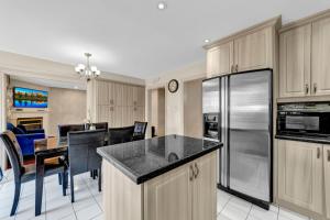 a kitchen and dining room with a counter top at Individual Bedroom - Charming Private Room and Ensuite in Shared Home in Mississauga