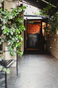 an entrance to a building with a black door at Hotel B Berdichevsky in Tel Aviv