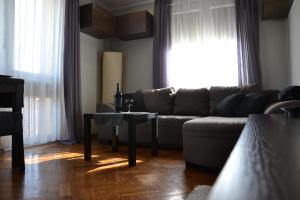a living room with a couch and a table at TRFAppartamento in Bielsko-Biała