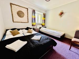 Posteľ alebo postele v izbe v ubytovaní APARTAMENT NAD KAMIEŃCZYKIEM II + 30 fotografií