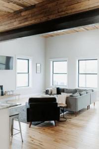 a living room with a couch and a table at Stadium Lofts on Meridian #1 in Indianapolis