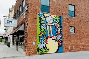 a mural on the side of a brick building at Stadium Lofts on Meridian #1 in Indianapolis