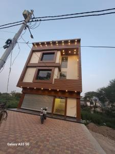 a house with a bike parked in front of it at Hotel ashiyana stay in Lucknow