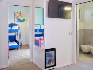 A bed or beds in a room at UNA HOTELS Imperial Beach Hotel