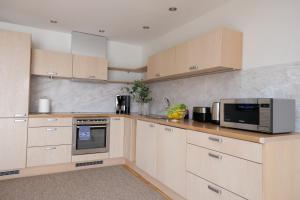 Kuchyň nebo kuchyňský kout v ubytování Tallinn City Apartments Roosikrantsi