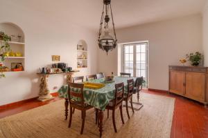 a dining room with a table and chairs at Manas Slowliving - Sines in Sines +26 photos