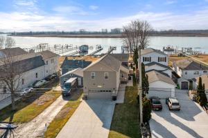 arial view of a residential neighborhood with a body of water at Lakeside Bliss 2BR, 1BA with All Modern Comforts in Algonac