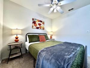 a bedroom with a bed and a ceiling fan at King Bed Retreat, Pet-Friendly, Rancho Cordova in Rancho Cordova