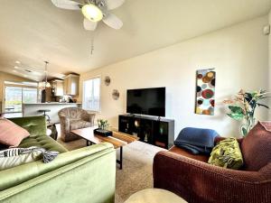 a living room with two couches and a flat screen tv at King Bed Retreat, Pet-Friendly, Rancho Cordova in Rancho Cordova