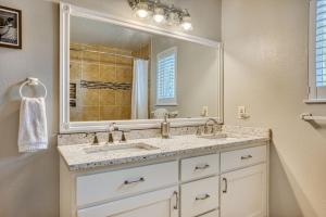 a bathroom with two sinks and a large mirror at Tranquility Base - Family Fun Modern Farm House in Dalton Gardens +51 photos