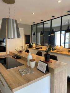 a kitchen with a island with a counter top at Embruns et Sarrasin in Combrit
