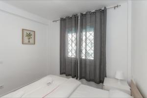 Postel nebo postele na pokoji v ubytování Apartamento Seven Seas