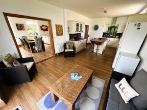 an aerial view of a living room and a kitchen at Littlestairs in Shanklin +41 photos