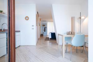 a kitchen and dining room with a table and chairs at La Casetta sul mare in Castellammare del Golfo +14 photos
