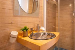 a bathroom with a sink and a mirror at La Casetta sul mare in Castellammare del Golfo