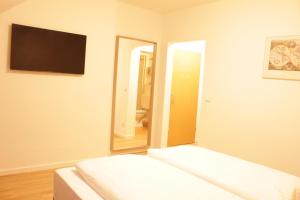 Postel nebo postele na pokoji v ubytování Isar City Hotel