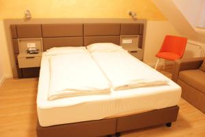 Postel nebo postele na pokoji v ubytování Isar City Hotel