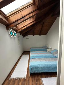 A bed or beds in a room at Apartma Popeye